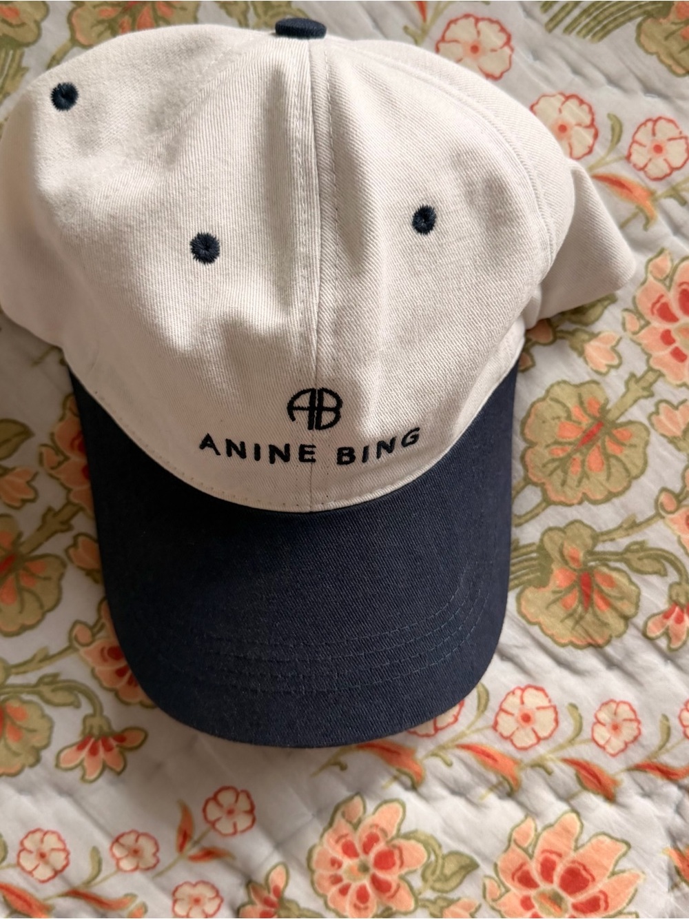 Cap on floral quilt